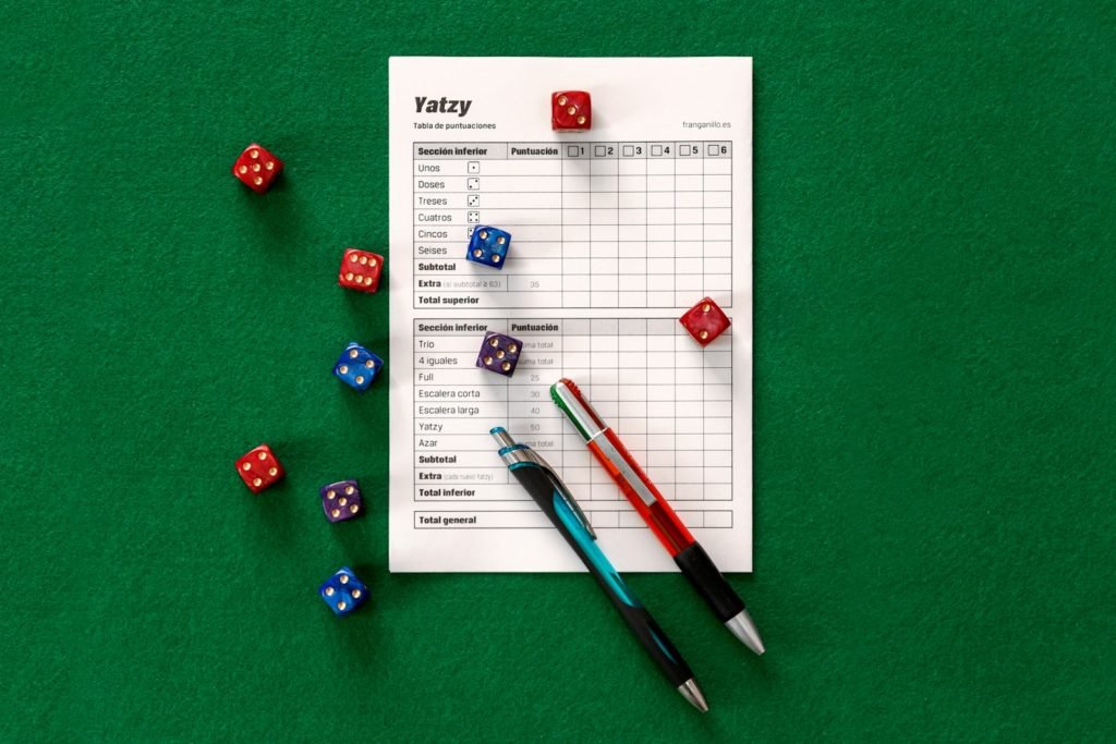 assorted-color dice on green surface